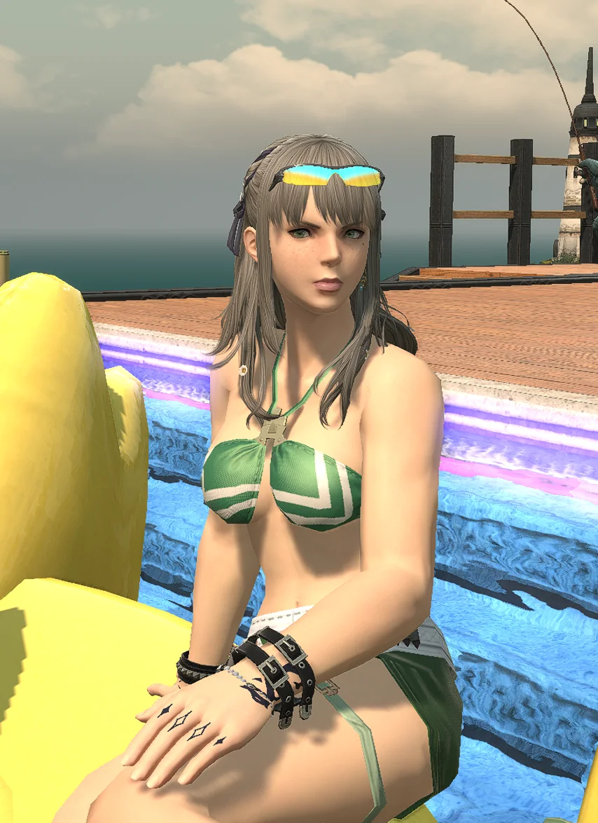 Aggro sitting beside a giant yellow duck float by the pool.