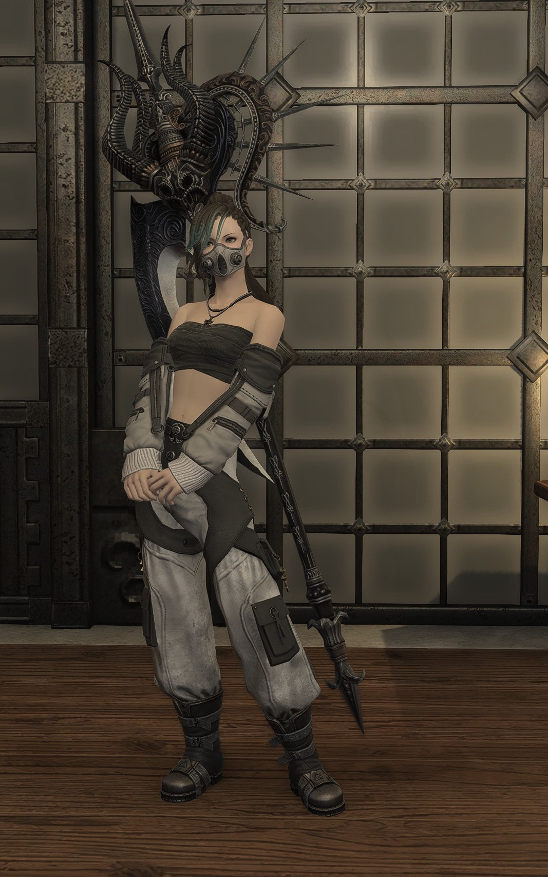 Aggro Phobic in a grey and black utility outfit with a face mask and large weapon.