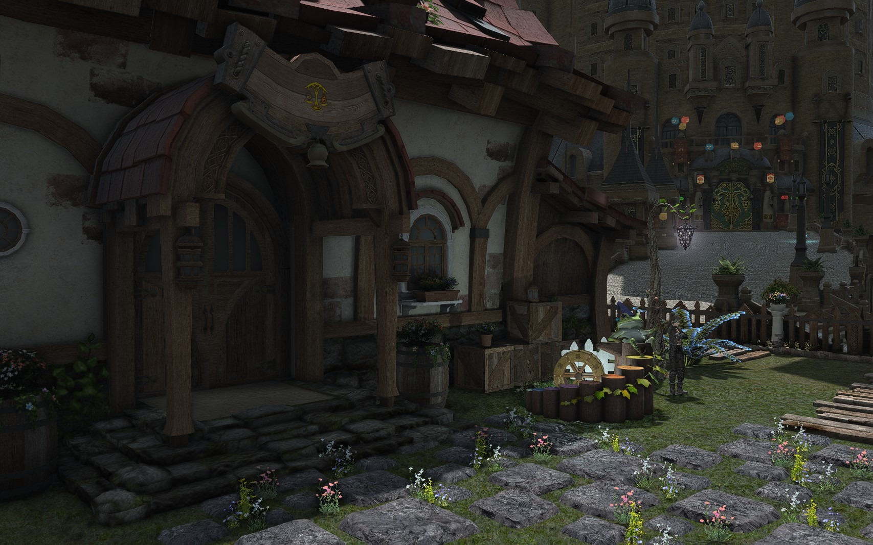Stone-and-flower garden path leading toward the house entrance with wooden crates and garden decorations.